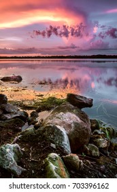 A Colorful Reflection Off Lake Baldwin At Sunset In Winter Park, FL.