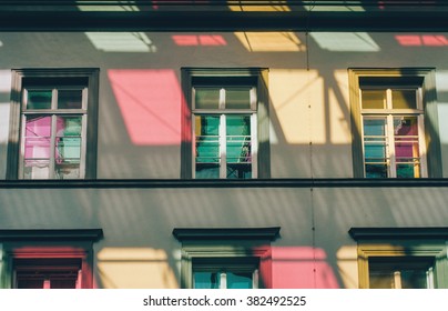Colorful reflections of windows on the facade of a building - Shutterstock ID 382492525