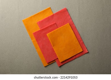 Colorful Reusable Beeswax Food Wraps On Grey Background, Top View