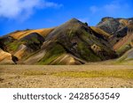 Colorful rhyolite hills surrounding a valley, Landmannalaugar, Fjallabak Nature Reserve, Central Highlands, Iceland.