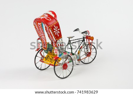 Colorful rickshaw toy model trishaw transport tricycle with word Bangladesh written in Bengali Text
