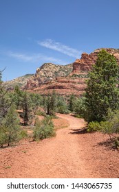 Colorful Rock Formation And Dusty Trail In The Sedona, Arizona Desert Landscape Near Wilson Mountain