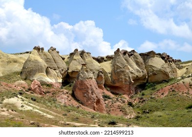 Colorful Rock Formation With Plants And Meadows In Cappadocia, Turkey