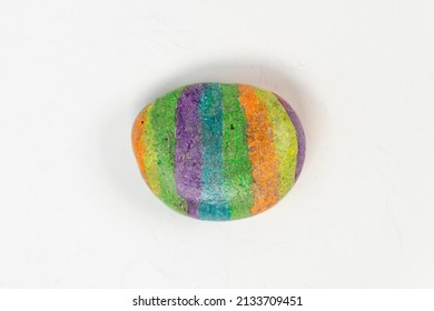 Colorful Rock Painted By Kid For Hobby Isolated On White Background, Rainbow Color On Round Rock, Top Wiev Of Hobbie Stone