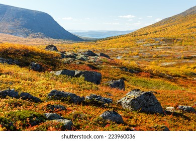 Colorful rocky tundra in front of Malaya Belaya river valley between mountains Alyavumchorr and Judychvumchorr in Hibiny mountains above the Arctic Circle, Russia