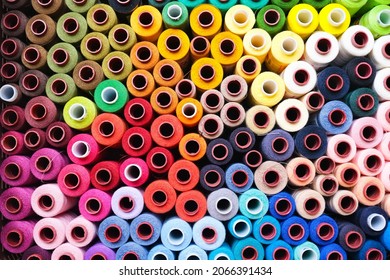 Colorful rolls of sewing thread in a box - Powered by Shutterstock