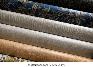 Colorful rolls of wallpaper as  background, Close up wall paper, vinyl and paper, Decorative  materials for renovation of room, interior in shop