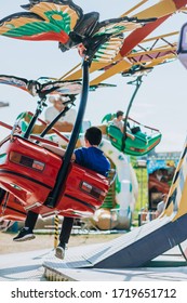 Colorful Rotating Chair Swing Ride At The Local Amusement Park