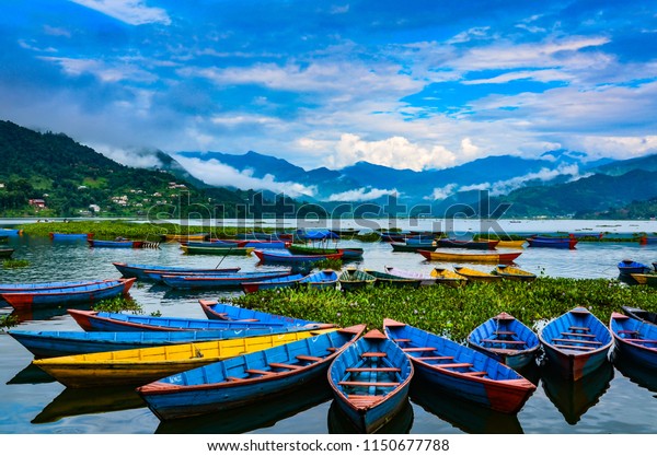 Colorful Row Boats Docked On Lake Stock Photo (Edit Now) 1150677788