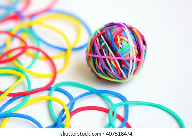 Colorful rubber band ball on white background
