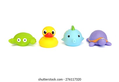 Colorful Rubber Duck And Other Bath Toys Isolated On White