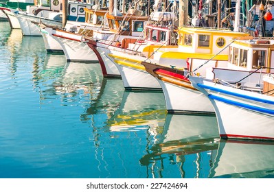 Colorful sailing boats at Fishermans Wharf marina pier in San Francisco Bay in California - Travel concept with wonderful destination in United States of America