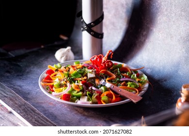 Colorful salad with vegetables, leaves and seeds