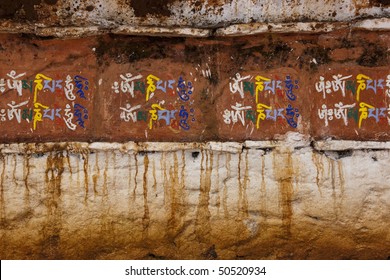 Colorful Sanskrit Writing On The Base Of A Stupa. Horizontal Shot