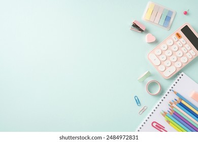 Colorful school supplies arranged on a light blue background, featuring pencils, calculator, binder clips, sticky notes, and washi tape for a back to school theme