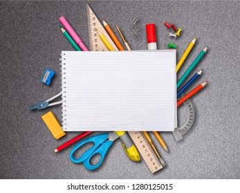 Colorful school supplies on wooden table background - Shutterstock ID 1280125015