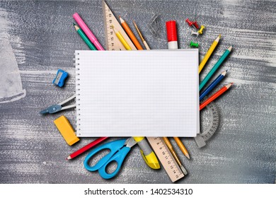 Colorful school supplies on wooden table background - Shutterstock ID 1402534310