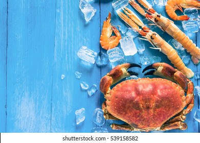 Colorful Sea Food On Wooden Blue Backgound From Above