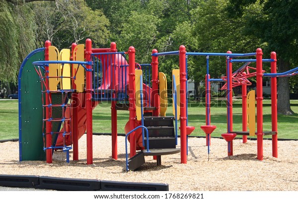 A colorful\
set of bars in an empty\
playground