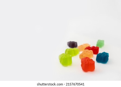 Colorful set of CBD infused medicinal candy gummies used for healing on a plain white background