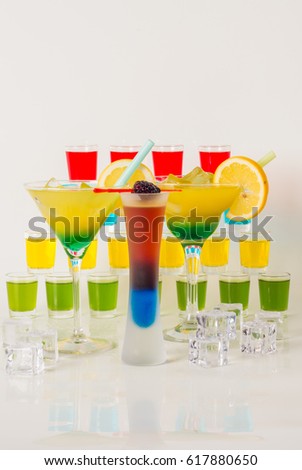 Colorful set of drinks, color drink decorated with fruit, many color kamikaze drink, shot drinks, party set