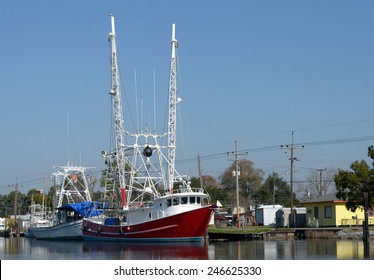 Colorful Shrimp Trawler Boats Docked On Bayou Lafourche In Southern Louisiana.