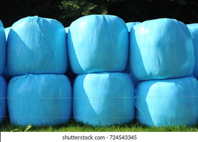 Colorful Silage Bale Wrap In Agricultural Pasture