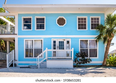 Colorful Single Family Blue Turquoise Teal And White Bungalow Home House By Beach With Palm Trees In South Florida