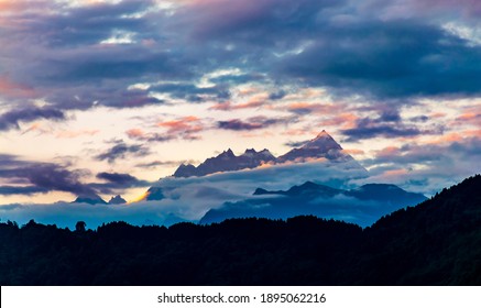 Colorful sky and cloudy Mt. Kanchenjunga