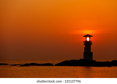 Colorful sky at sunset behind lighthouse