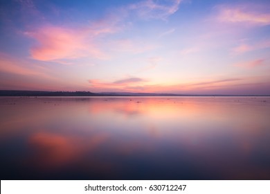 Colorful sky and colorful water in lake reflected in evening 
