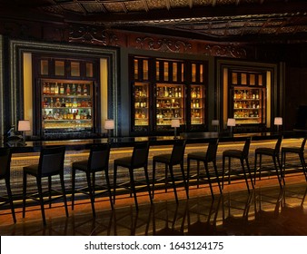 Colorful, Sleek Jazz Bar With Rows of Bar Stools; Empty Bar, Social Distancing