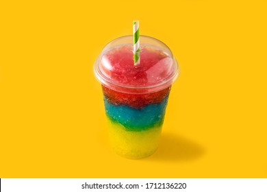 Colorful slushie of differents flavors on yellow background