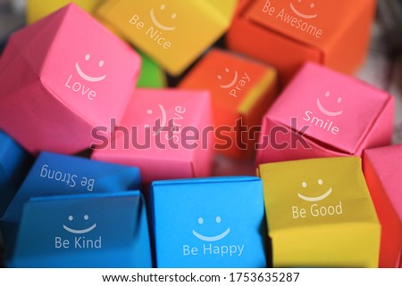 Colorful  smiling gift boxes background with kindness words and positive motivational inspirational single word on it.