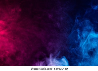 colorful smoke on dark background - Shutterstock ID 569530480