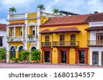 Colorful spanish colonial buildings with wooden balconies at Plaza de los Coches inside the walled city of Cartagena de Indias, Colombia. UNESCO world heritage site.