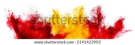 colorful spanish flag black red yellow color holi paint powder explosion isolated on white background. Spain europe celebration soccer travel tourism concept