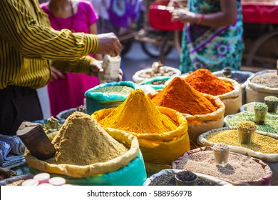 Colorful spices powders and herbs in traditional street market in Delhi. India. - Shutterstock ID 588956978