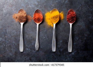 Colorful spices in spoons. Top view - Powered by Shutterstock