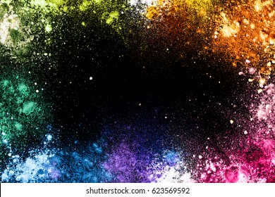 Colorful Splashes Of Rainbow Dust On A Black Background