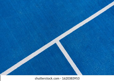 Colorful Sports Court Background. Top View To Blue Field Rubber Ground With White Line Outdoors