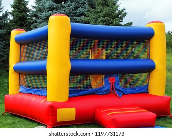 Colorful Square Children's Bounce House With Reds, Blues, And Yellows