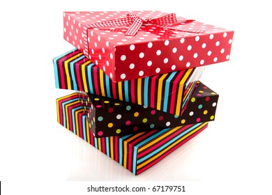 Colorful stack with presents with stripes and dotts