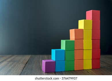 Colorful stack of wood cube building blocks - Shutterstock ID 376479937
