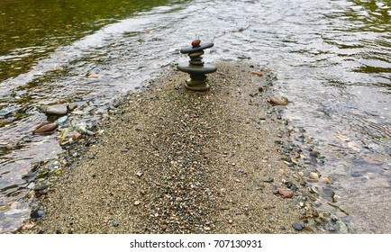 Colorful Stacked Rocks On The Rogue River In Oregon