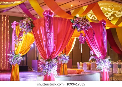 The colorful stage decoration with bright shade of color for bride and groom in the sangeet night of traditional indian wedding