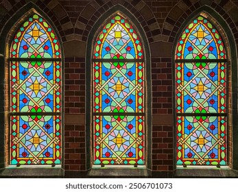 colorful stained glass windows in a church - Powered by Shutterstock