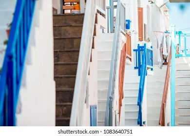 Colorful stairs on old narrow streets of greek island. Beautiful architecture building exterior with cycladic style. - Powered by Shutterstock