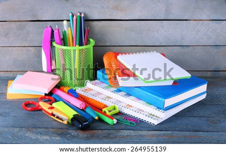 Colorful stationery on wooden background
