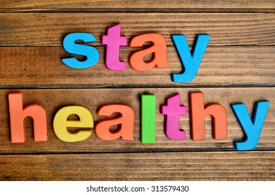 Colorful Stay Healthy Word On Wooden Table